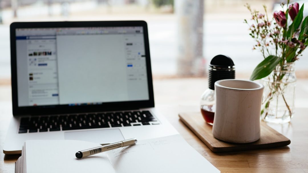 Photo by Nick Morrison MacBook Pro near white open book